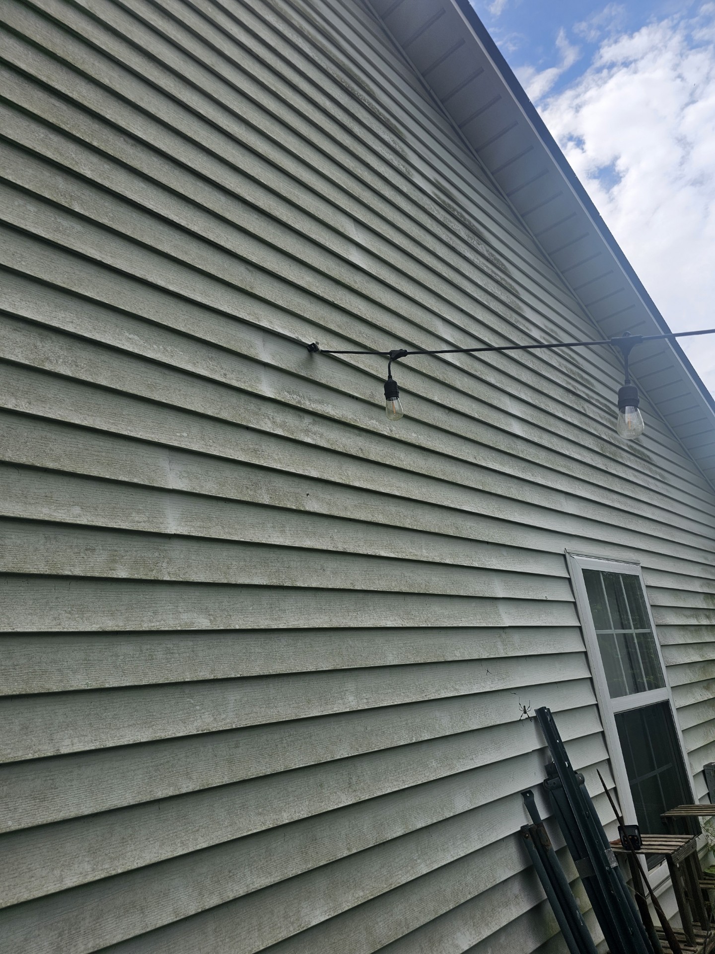 Heavy mold removal during residential house soft wash in Jacksonville North Carolina Thumbnail